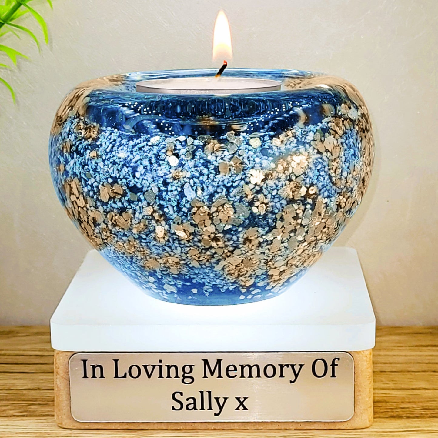 Ashes in glass tealight silver & gold flakes.