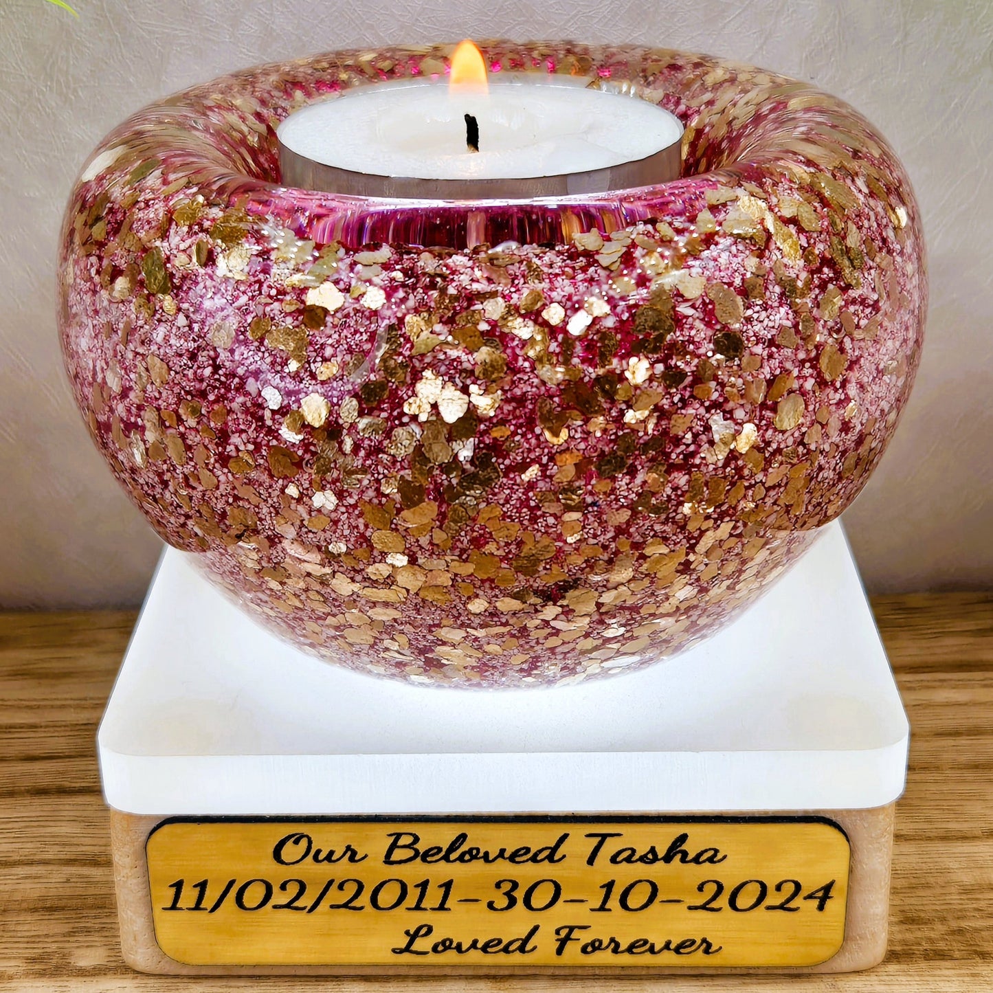 Ashes in glass tealight silver & gold flakes.