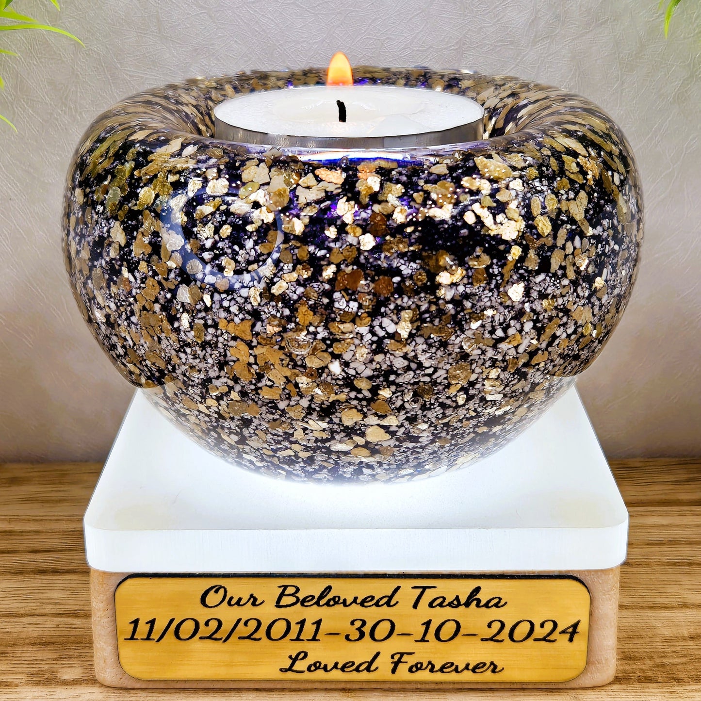 Ashes in glass tealight silver & gold flakes.