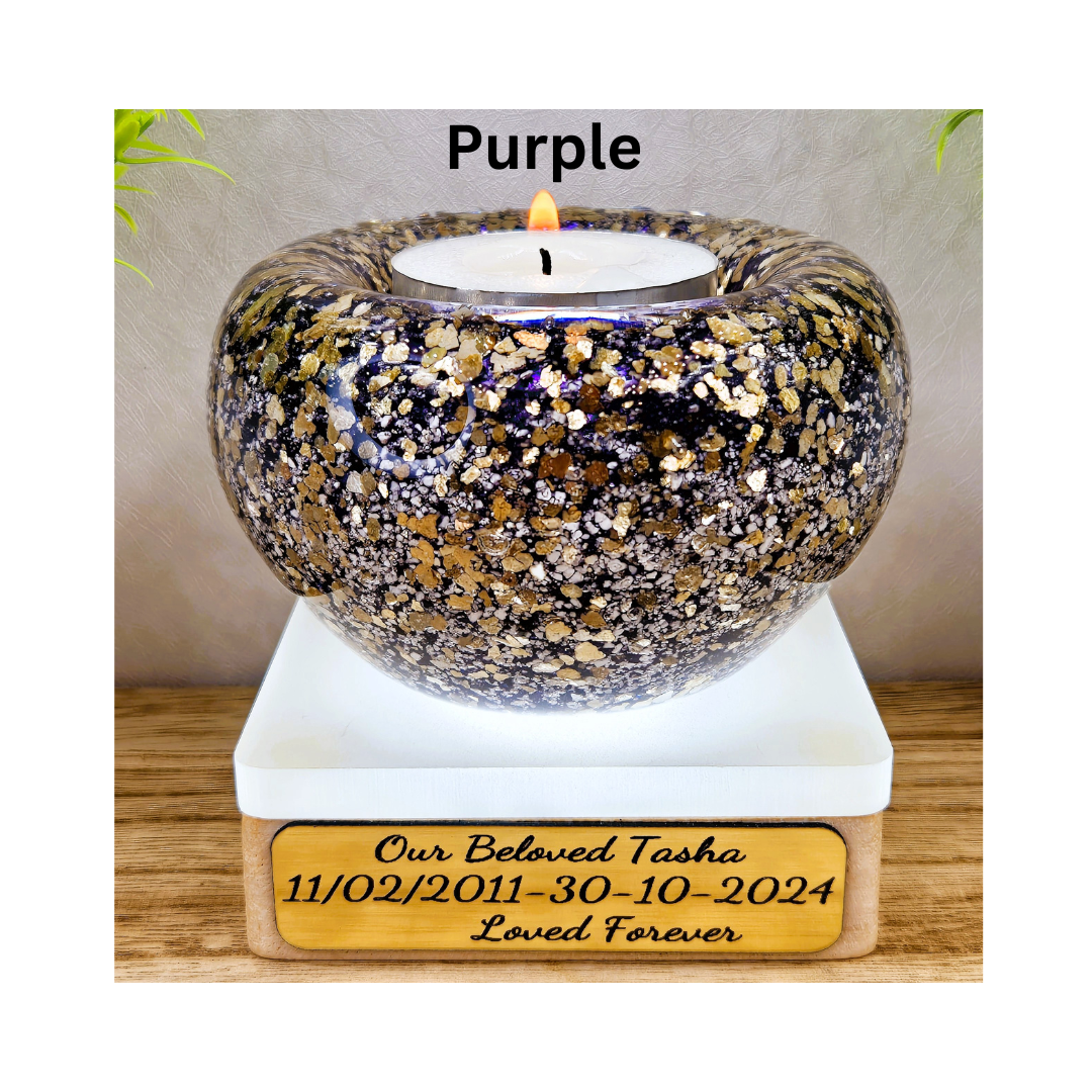 Ashes in glass tealight silver & gold flakes.