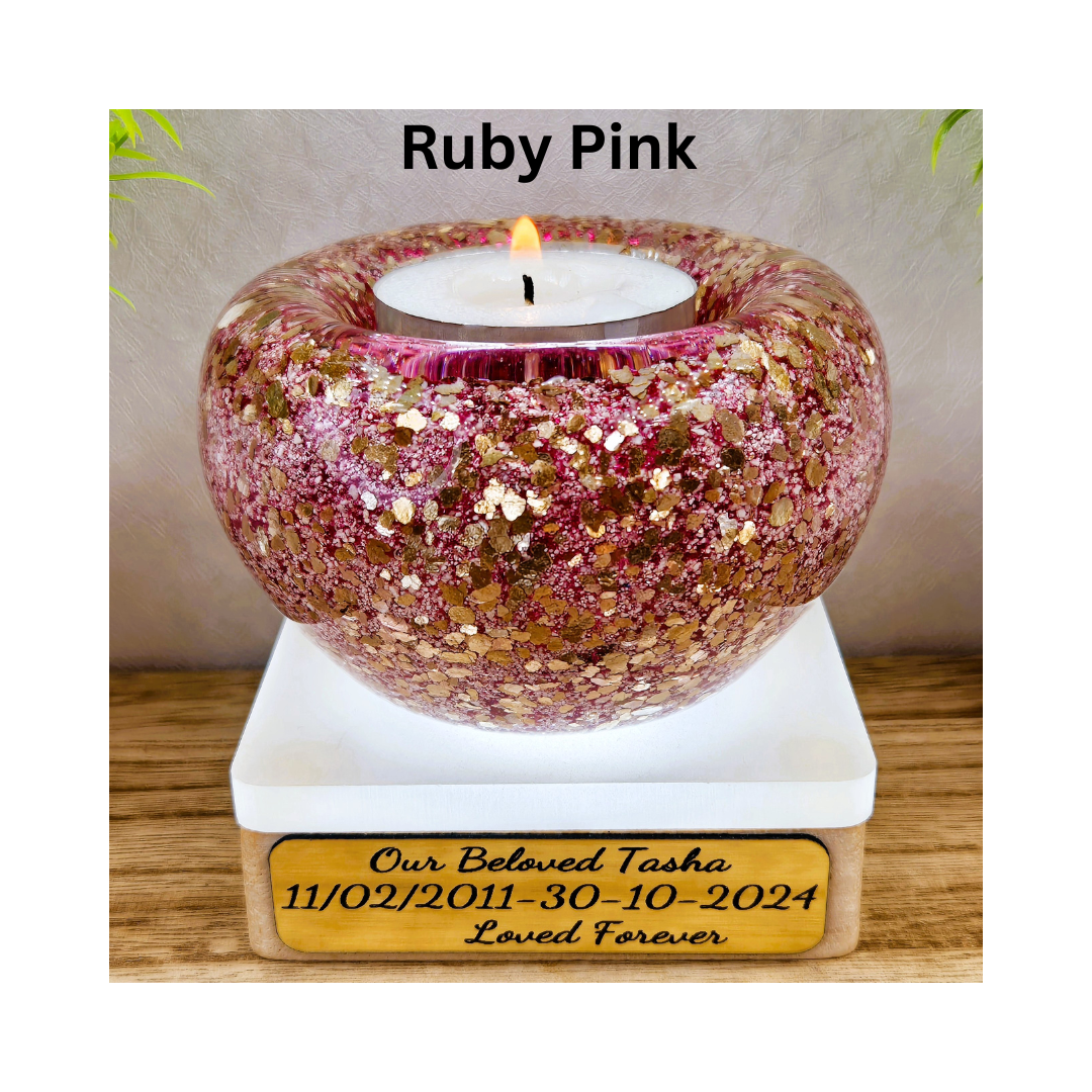 Ashes in glass tealight silver & gold flakes.