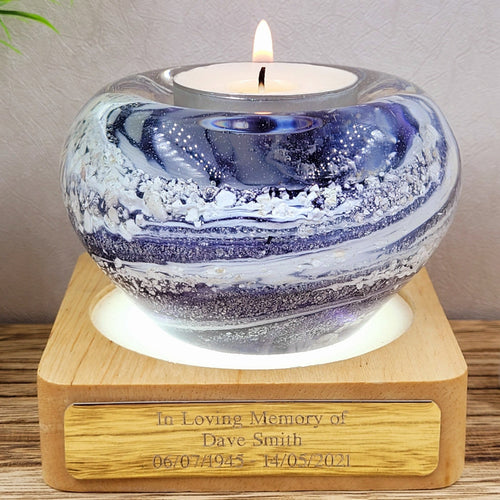 purple swirl creation ashes infused in glass on illuminated light stand with personalised plaque