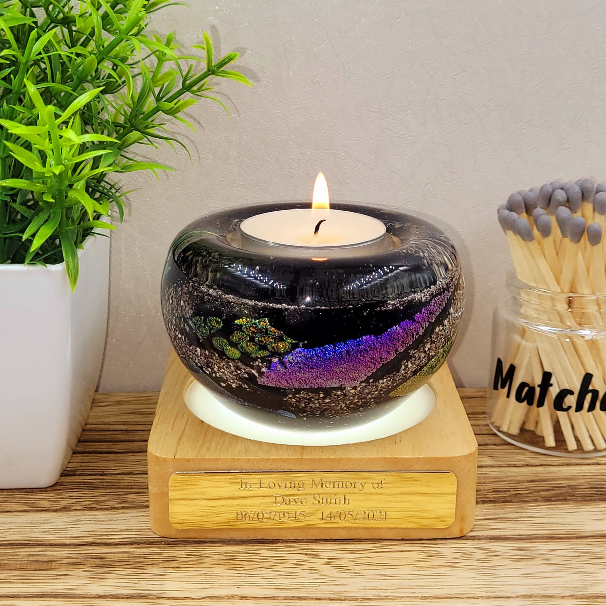 ashes in glass candle holder