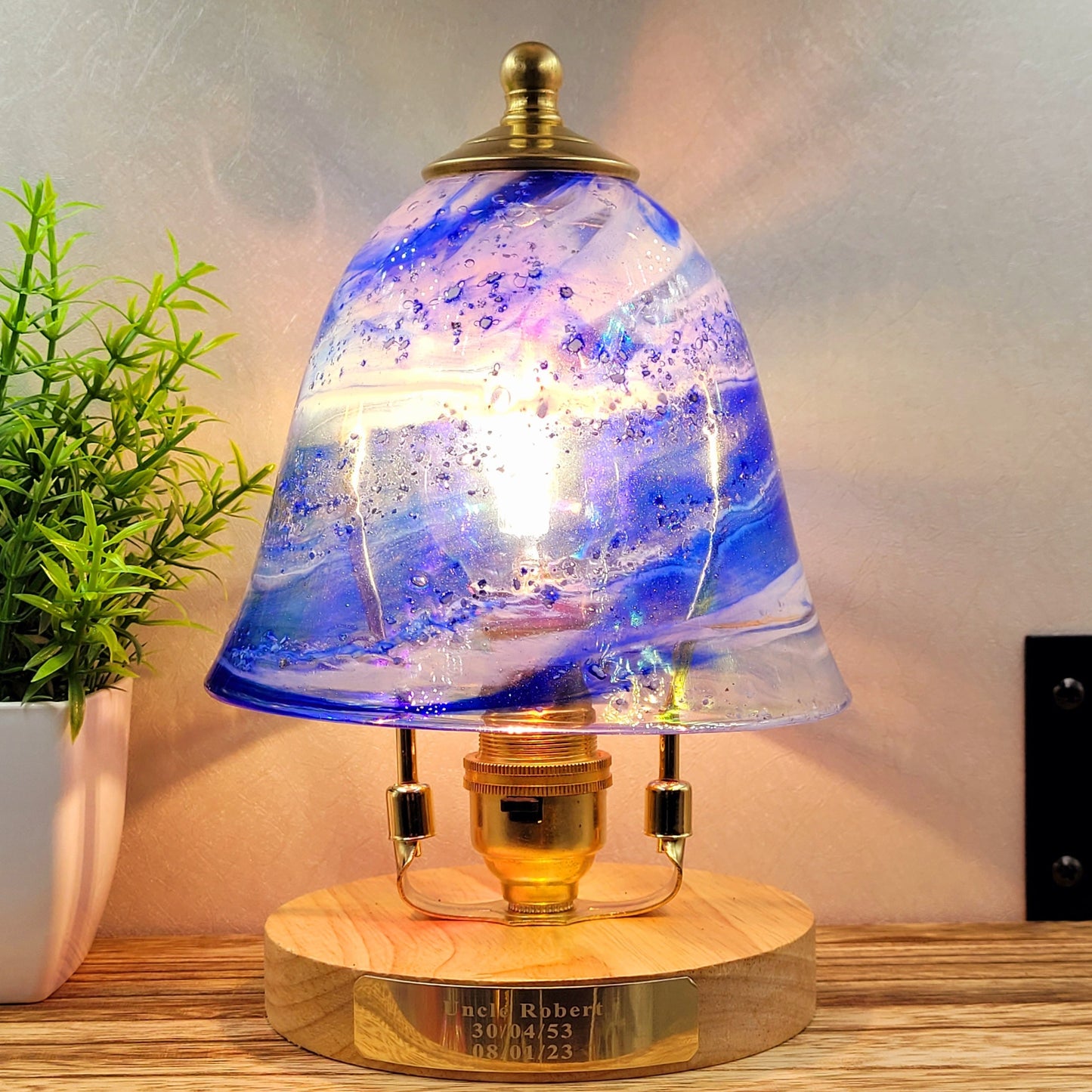 Ashes in glass table lamp