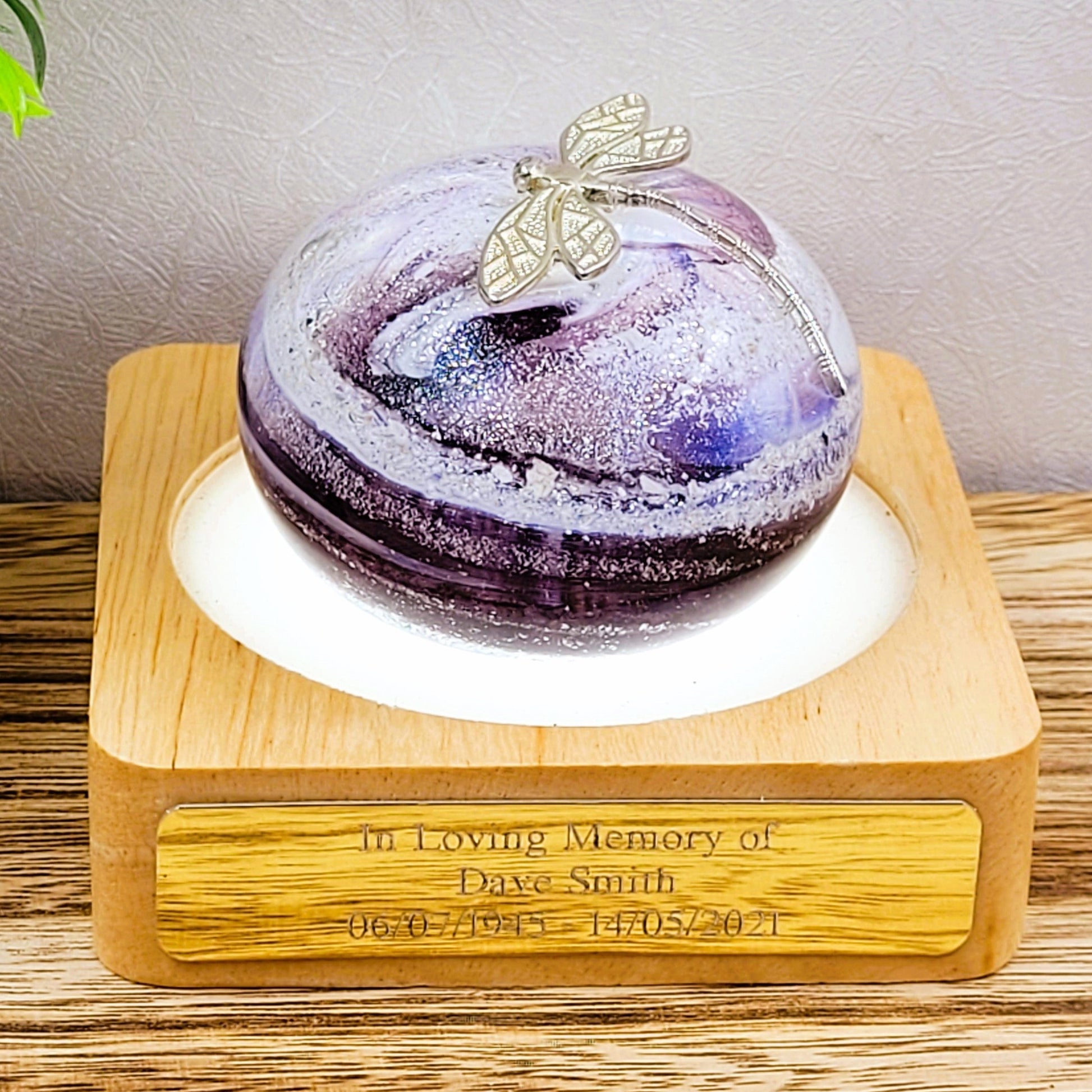 purple ashes in glass paperweight with silver pewter dragonfly